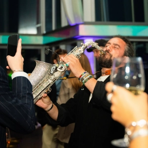 The Sax Man playing at a HEDGE event